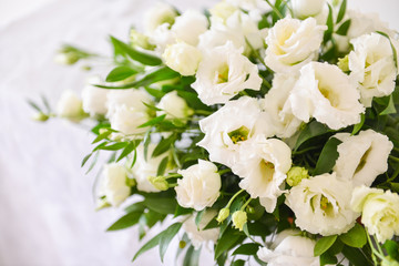 floral arrangement for interior decoration, table setting for a wedding or to create a home cosiness. use as background. white flowers bells