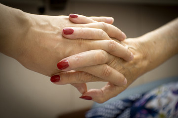 Hands of elderly person with senile dementia