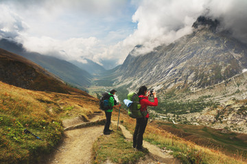 Fototapeta na wymiar A hiking trip with a backpack of alpine mountains.