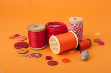 closeup of sewing set on orange background