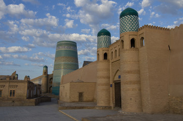 Khiva, Uzbekistan, 1 may 2015: The view on Kalta Minor Minaret behind the Kunya-Ark fortress