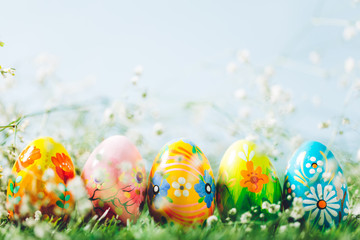 Decorative eggs on green grass.