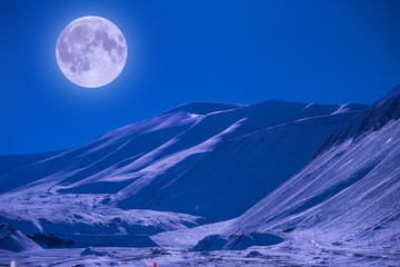 The polar arctic full red super moon eclipse sky star in Norway Svalbard in Longyearbyen city  mountains