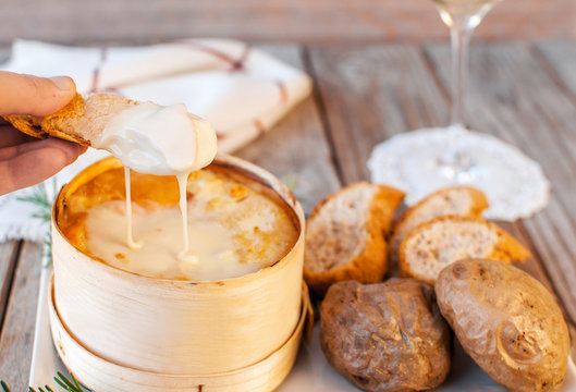 Mont d'or cheese. Traditional french  recipe - La bo&icirc;te chaude. Delicious French Cheese. Mont-d'Or chaud.