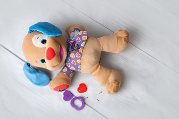 Fluffy dog toy with broken heart button