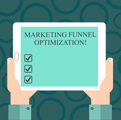 Writing note showing Marketing Funnel Optimization. Business photo showcasing Improving the customer acquisition campaign Hu analysis Hand Holding Tablet Smartphone Display Unit photo