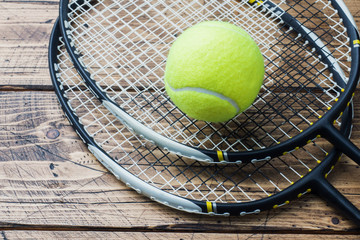 Tennis Ball and rackets on Wood Background, Sport Concept and Idea, Rustic Style. © Elenglush
