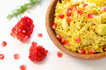 Fresh pilaf/risotto with garnet and rosemary