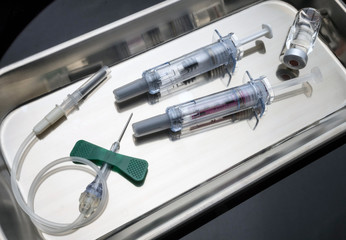 Subcutaneous Set and syringe in a laboratory, conceptual image