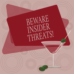 Writing note showing Beware Insider Threats. Business photo showcasing Be cautious on malicious attack inside the network Filled Cocktail Wine Glass with Olive on the Rim Text Space