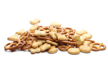 Salty cracker pretzel party mix isolated on white background