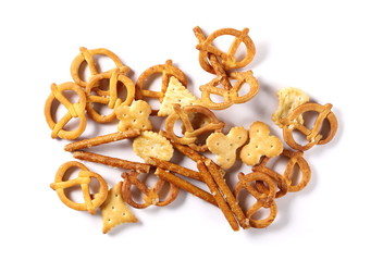 Salty cracker pretzel party mix isolated on white background, top view