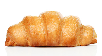 Big fresh croissant on white background