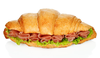 Big croissant with green salad and pork meat