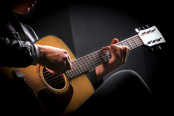 Young men playing the guitar