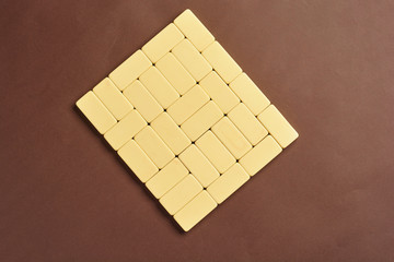 Playing dominoes on a dark background . The concept of the game of dominoes. Close up.