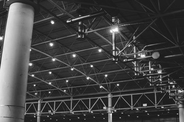 Interior of warehouse. large metal structures, ceiling. roof. concept production and installation of equipment for rooms, lighting, ventilation and windows for hangars, black and white