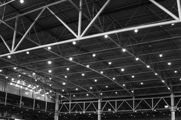 Interior of warehouse. large metal structures, ceiling. roof. concept production and installation of equipment for rooms, lighting, ventilation and windows for hangars, black and white