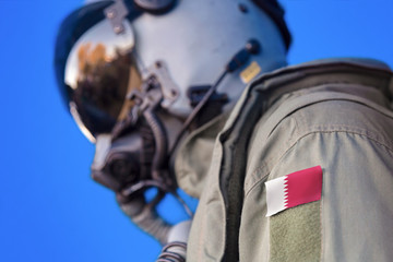 Air force pilot flight suit uniform with Qatar flag patch. Military jet aircraft pilot	