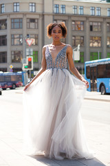 Obraz premium Sexy african woman in white long dress