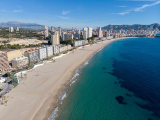 Aerial photo taken in Benidorm in Spain Alicante, showing the beautiful beach of Playa Levante and hotels, buildings, and high rise skyline cityscape.