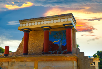 North Entrance of the Knossos Palace complex with charging bull fresco and red columns, with red...