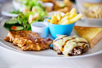 Fish pork and chicken steak meal set - clean fresh food on table concept