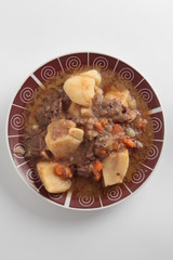 dish of stewed beef with potatoes and carrot