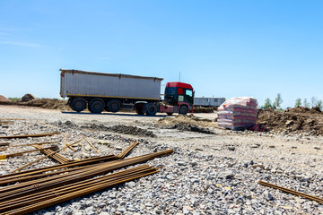 Fototapeta premium Truck transport, logistics on building site