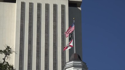 Zoom out from US and State Flags, Florida State Capitol building, Tallahassee, USA