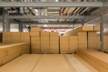 Warehouse interior with shelves rack for keep production material, pallets and boxes.