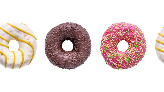 Donuts colorful animation isolated on a white background. Moving Doughnuts seamless loop.