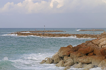 the sea is the shore of the rocks