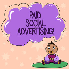 Word writing text Paid Social Advertising. Business concept for external marketing efforts involve a paid placement Baby Sitting on Rug with Pacifier Book and Blank Color Cloud Speech Bubble
