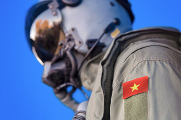 Air force pilot flight suit uniform with Vietnam flag patch. Military jet aircraft pilot	