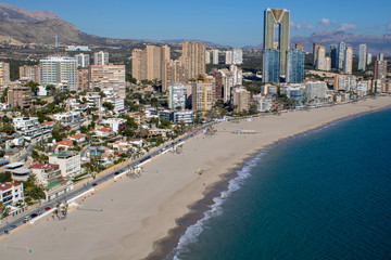 Aerial photo taken in Benidorm in Spain Alicante, showing the beautiful beach of Playa Levante and hotels, buildings, and high rise skyline cityscape.