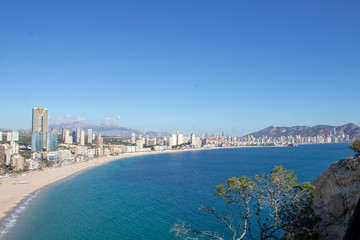 Aerial photo taken in Benidorm in Spain Alicante, showing the beautiful beach of Playa Levante and hotels, buildings, and high rise skyline cityscape.