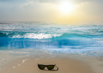 Seascape Sunrise sunglasses over sand Sea beach