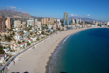 Fototapeta na wymiar Aerial photo taken in Benidorm in Spain Alicante, showing the beautiful beach of Playa Levante and hotels, buildings, and high rise skyline cityscape.