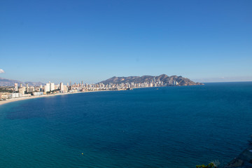Fototapeta premium Aerial photo taken in Benidorm in Spain Alicante, showing the beautiful beach of Playa Levante and hotels, buildings, and high rise skyline cityscape.