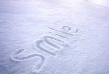 smile inscription in the snow