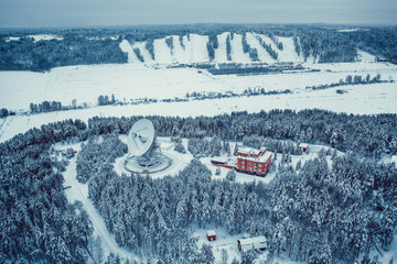 Large satellite dishes, communication technology, radio telescope in frozen Russia landscape
