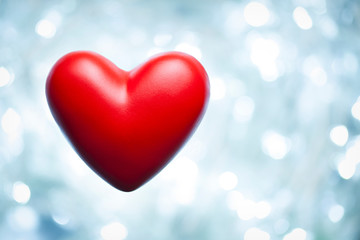 Red heart on abstract lighting background