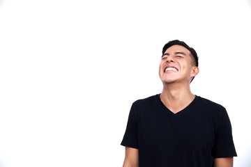 Handsome latin hispanic man is happy and giggling.