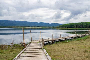 Fototapeta na wymiar Scenic view landscape of bamboo bridge and lake.