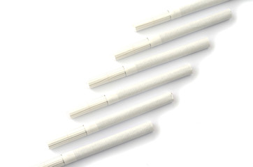 Fototapeta premium Cigarettes in different position on a white background.