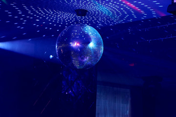 Mirror disco ball at a music party.