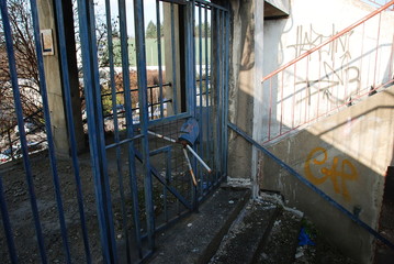 A broken entrance into tribunes of abandoned and decay football stadium in Brno