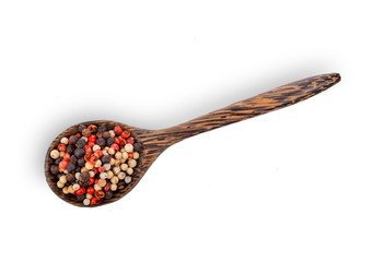 dried peppers in wood spoon isolated on white background