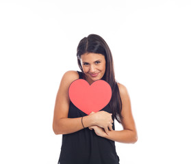 beautiful happy young woman who is holding a big red heart for valentine's day